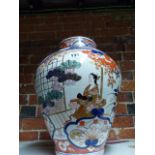 A POTTERY JAR DECORATED IN 18th.C.JAPANESE IMARI TASTE. H.37cms.