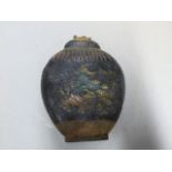 ATTRIBUTED TO WANG JINSHENG. A QING DYNASTY INK CAKE, THE FLATTENED OVOID JAR SHAPE MOULDED IN LOW