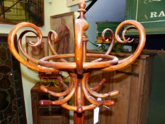 A THONET STYLE BENTWOOD COAT AND STICKSTAND, SIX HOOKS RAISED ON THE COLUMN OF QUATREFOIL SECTION