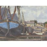 20th.C.BRITISH SCHOOL. FISHING BOATS AT LOW TIDE, SIGNED INDISTINCTLY OIL ON BOARD. 38 x 60.5cms.