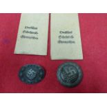 TWO THIRD REICH RAD BADGES AND TWO WEST WALL MEDALS WITH ENVELOPES OF ISSUE. (4)