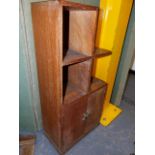 A HEAL'S SMALL OAK BOOKCASE CABINET WITH A TWO DOOR BASE. 40 x 23 x H.87cms.