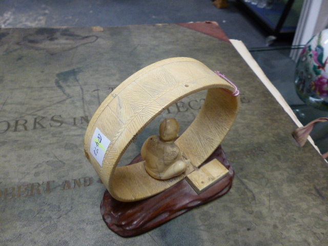 A JAPANESE IVORY FIGURE SEATED WITHIN AN UNFINISHED COOPERED TUB ON IT'S SIDE. H.12cms. - Image 3 of 10