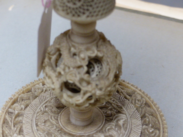 A CHINESE IVORY PUZZLE BALL CARVING WITH STAND HAVING A ROTATING RETICULATED KNOP AND A FURTHER - Image 14 of 20