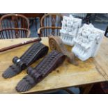 A PAIR OF STAINED PINE LEAF CARVED SCROLL BRACKETS. H.50cms ANOTHER PINE BRACKET AND A PAIR OF