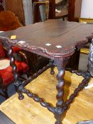 A WALNUT LOW TABLE, THE WAVY EDGED RECTANGULAR TOP ON BARLEY TWIST LEGS AND STRETCHERS. 58 x 49 x