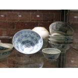 A COLLECTION OF PROVINCIAL CHINESE BLUE AND WHITE WARES TO INCLUDE NINE BOWLS AND A JAR, THREE