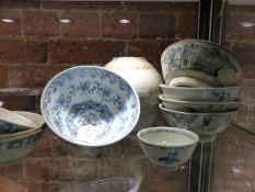 A COLLECTION OF PROVINCIAL CHINESE BLUE AND WHITE WARES TO INCLUDE NINE BOWLS AND A JAR, THREE