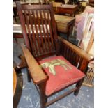 NAVAL INTEREST. AN ARTS AND CRAFTS PERIOD TEAK RECLINING ARMCHAIR MADE FROM TIMBER OF H.M.S. REKNOWN