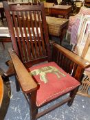 NAVAL INTEREST. AN ARTS AND CRAFTS PERIOD TEAK RECLINING ARMCHAIR MADE FROM TIMBER OF H.M.S. REKNOWN