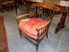 A LATE VICTORIAN WALNUT FRAME LOW ARMCHAIR IN THE ARTS AND CRAFTS MANNER.