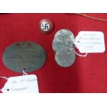 3RD SS PANXER GRENADIERS TOTENKOPF IDENTITY TAGS, THREE CAMP TAGS AND A PARTY BADGE.