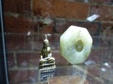 A CHINESE NEPHRITE JADE PENDANT WITH CENTRAL YIN AND YAN ROUNDEL ROTATABLE WITHIN SHOU CHARACTERS.