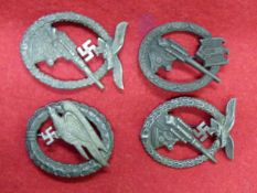 TWO LUFTWAFFE FLAK BADGES, ONE FURTHER AND A PARACHUTIST'S BADGE. (4)