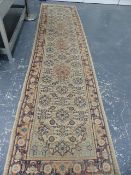 AN ORIENTAL RUNNER OF PERSIAN TABRIZ DESIGN. 332 x 79cms.