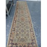 AN ORIENTAL RUNNER OF PERSIAN TABRIZ DESIGN. 332 x 79cms.