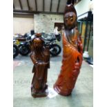 A CHINESE RED STAINED HORN FIGURE OF GUANYIN. H.24.5cms TOGETHER WITH WITH A CARVED WOOD FIGURE OF