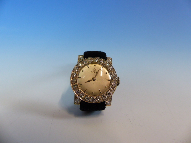 A LADIES PLATINUM AND DIAMOND WATCH FITTED WITH A VINTAGE OMEGA MANUAL WOUND MOVEMENT. THE INSIDE - Image 10 of 18