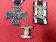 1939 BAR TO THE 1914 CROSS, MOUNTED ON RIBBON, A 1914 2ND CLASS IRON CROSS AND A 1939 SECOND CLASS