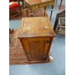 AN ARTS AND CRAFTS OAK AND INLAID BEDSIDE CABINET