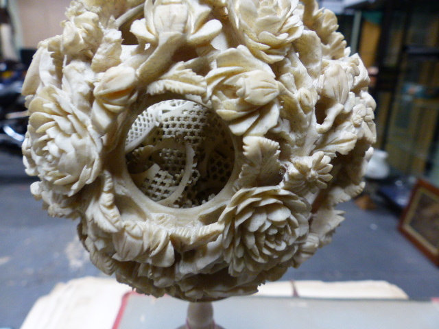 A CHINESE IVORY PUZZLE BALL CARVING WITH STAND HAVING A ROTATING RETICULATED KNOP AND A FURTHER - Image 7 of 20
