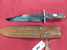 A 20th.C.BOWIE KNIFE WITH 24cms LONG BLADE, ETCHED AND GILT DECORATION MARKED THE CALIFORNIA KNIFE