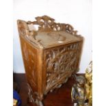 A CARVED FRUITWOOD MAGAZINE BOX, THE LID CARVED WITH WARRIOR HEAD ROUDEL, THE FRONT WITH APPLIED