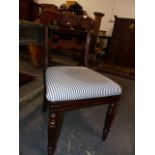 A SET OF FOUR Wm.IV. CARVED ROSEWOOD DINING CHAIRS ON TURNED AND REEDED LEGS. (4)