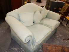 A PALE BLUE UPHOLSTERED TWO SEAT SETTEE WITH ARCHED BACK. 180 x 95 x H.98cms.