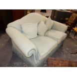 A PALE BLUE UPHOLSTERED TWO SEAT SETTEE WITH ARCHED BACK. 180 x 95 x H.98cms.