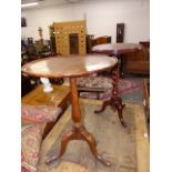 A VICTORIAN CARVED WALNUT LAMP TABLE WITH BARLEY TWIST SUPPORT TOGETHER WITH A GEORGIAN EXAMPLE.