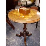 A WALNUT TRIPOD TABLE, THE ROUND TOP INLAID WITH A CHESS BOARD. H.70 x Dia.55cms TOGETHER WITH A RED