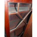 A GEORGIAN AND LATER MAHOGANY BUREAU BOOKCASE WITH ASTRAGAL GLAZED UPPER OVER FITTED FALL AND ONE