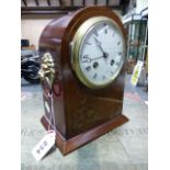 A BRASS INLAID MAHOGANY CASED FRENCH PENDULUM CLOCK STRIKING ON A COILED ROD, THE ROUND DIAL WITH