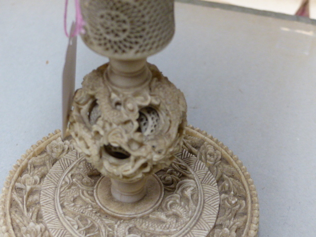 A CHINESE IVORY PUZZLE BALL CARVING WITH STAND HAVING A ROTATING RETICULATED KNOP AND A FURTHER - Image 15 of 20