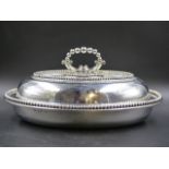 AN OVAL SILVER VEGETABLE DISH AND COVER WITH REMOVABLE BEADED HANDLE BY ELKINGTON & CO, B'HAM 1853