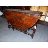 A RARE 17th/18th.C.SOLID YEW WOOD COTTAGE GATELEG TABLE WITH TURNED SUPPORTS AND STRETCHERS, THE