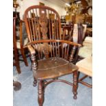 A 19th.C YEW WOOD AND ELM WINDSOR ARMCHAIR WITH CRINOLINE STRETCHER.