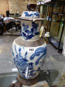 A CHINESE CRACKLEWARE BLUE AND WHITE BALUSTER VASE AND COVER PAINTED WITH PHOENIXES AND FLOWERS