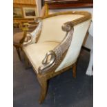 AN ARMCHAIR IN NEO-CLASSICAL TASTE, SWAN'S HEADS RESTING ABOVE THE SEAT ON SABRE FRONT LEGS.