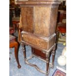 AN 18th.C.AND LATER OAK AND BURRWOOD CABINET ON STAND THE TWO DOOR UPPER SECTION ENCLOSING FITTED