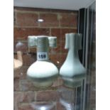 TWO CHINESE GUAN TYPE ARROW VASES, ONE WITH BLACK CRACKLED GREEN GLAZE. H.14.5cms THE OTHER WITH