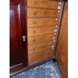 A GEORGIAN AND LATER OAK COLLECTOR'S CABINET, THE BASE FITTED WITH SHALLOW SPECIMEN DRAWERS ENCLOSED