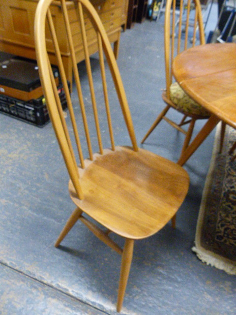 AN ERCOL PALE ELM DROP LEAF DINING TABLE AND A SET OF FOUR HIGH HOOP BACK DINING CHAIRS. (5) - Image 5 of 7