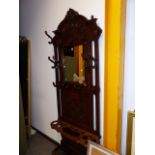 A LATE 19th.C.CARVED OAK MIRROR BACKED HAT / STICKSTAND. W.95 x H.238cms.