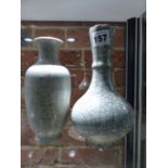 TWO CHINESE GUAN TYPE GREY CRACKLEWARE VASES, ONE OF BOTTLE SHAPE WITH FLUTING BELOW THE SERRATED