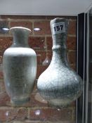 TWO CHINESE GUAN TYPE GREY CRACKLEWARE VASES, ONE OF BOTTLE SHAPE WITH FLUTING BELOW THE SERRATED