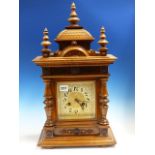 A LATE VICTORIAN WALNUT CASED MANTLE CLOCK WITH PAINTED AND GILT DIAL WITH GONG STRIKE MOVEMENT.