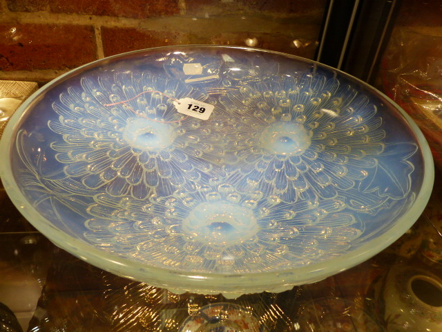 A PIERRE D'AVESN IRRIDESCENT GLASS DISH REVERSE MOULDED WITH THREE DAISY HEADS, SIGNED WITHIN THE