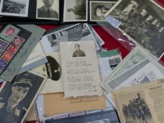 AN ALBUM OF THIRD REICH PORTRAIT PHOTOGRAPHS TOGETHER WITH A SELECTION OF THIRD REICH STAMPS,